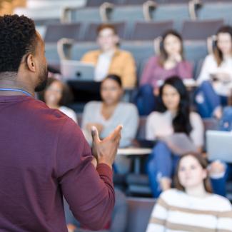 Black Man Teaching a Classroom of Students